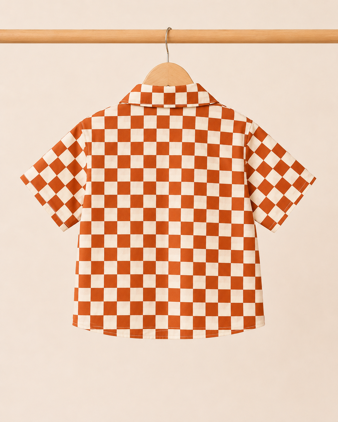 Boys rust cream checkerboard shirt - back view on hanger